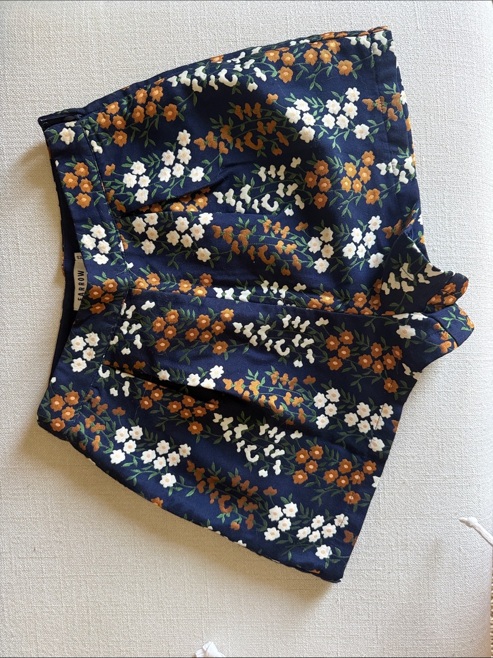Need Supply Farrow Navy Pleated Floral Shorts with Orange & White Blooms